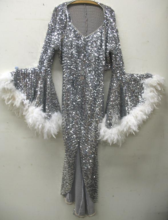 Appraisal: A Shirley Bassey style full silver sequinned fitted dress and