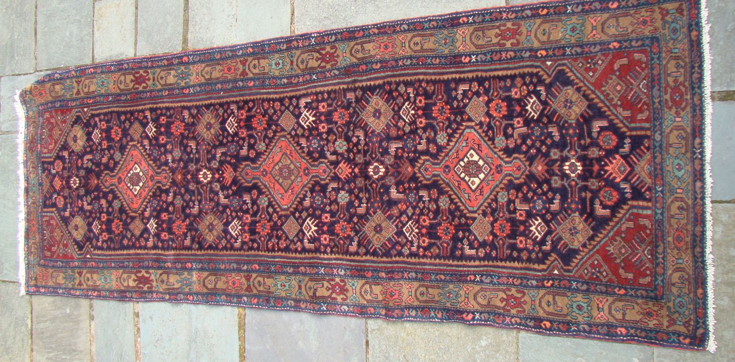 Appraisal: ORIENTAL RUG MALAYER ' x ' Geometric medallions and stylized