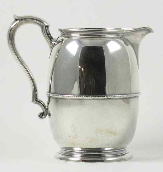 Appraisal: International Sterling Water Pitcher pints monogrammed foliate band surrounding middle