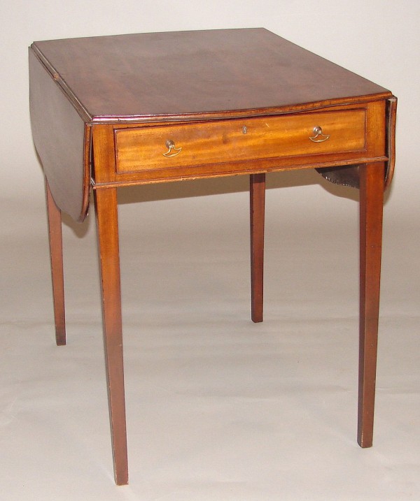 Appraisal: Mahogany bow front shaped drop leaves one drawer base one