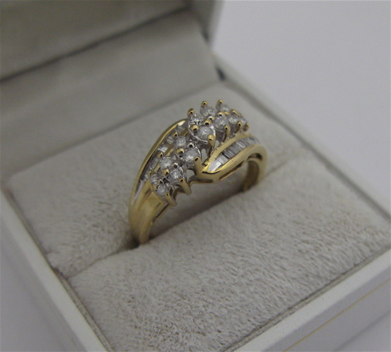 Appraisal: DIAMOND AND TEN KARAT GOLD RING set with round-cut and