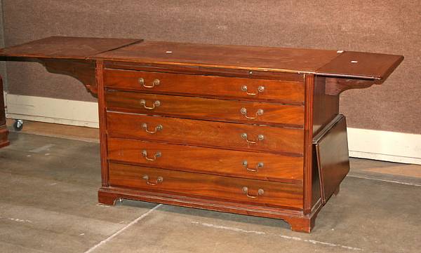 Appraisal: A Neoclassical style walnut sideboard with drop leaves mid th