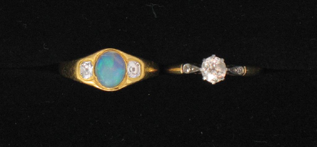 Appraisal: AN OPAL AND DIAMOND DRESS RING the central oval cabochon