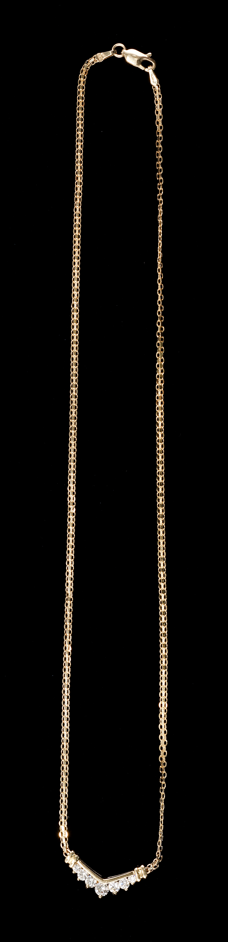 Appraisal: KT YELLOW GOLD AND DIAMOND NECKLACE Seven diamonds in a