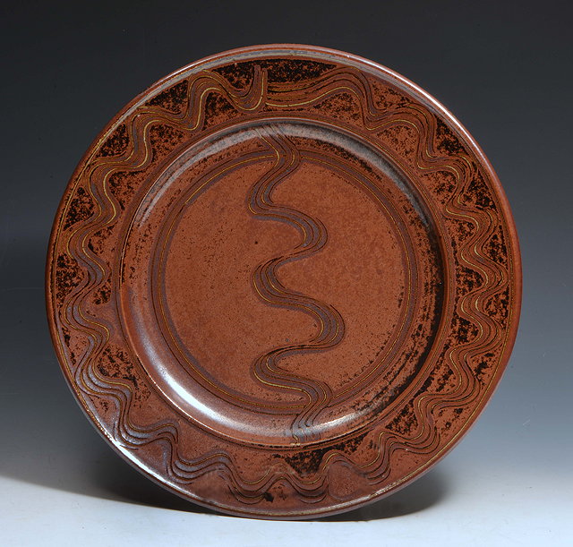 Appraisal: Ray Finch British - Charger tenmoku with combed decorationimpressed potter's