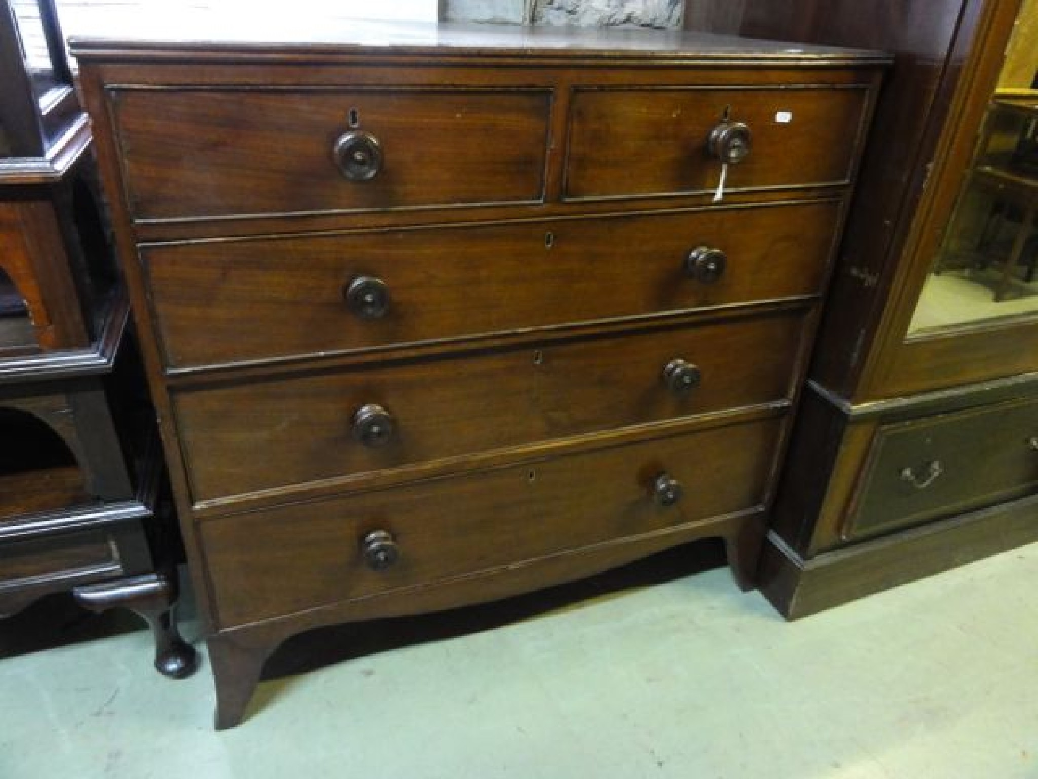 Appraisal: A th century mahogany bedroom chest of three long and