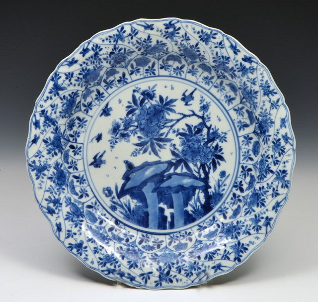 Appraisal: A CHINESE BLUE AND WHITE PORCELAIN DISH the centre panel