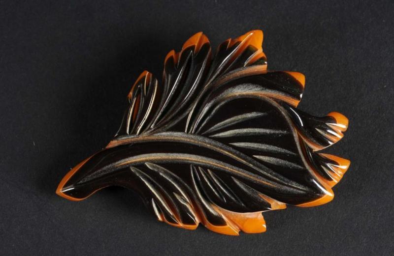 Appraisal: Bakelite Two-Tone Leaf Pin Description Black over gold Condition Excellent