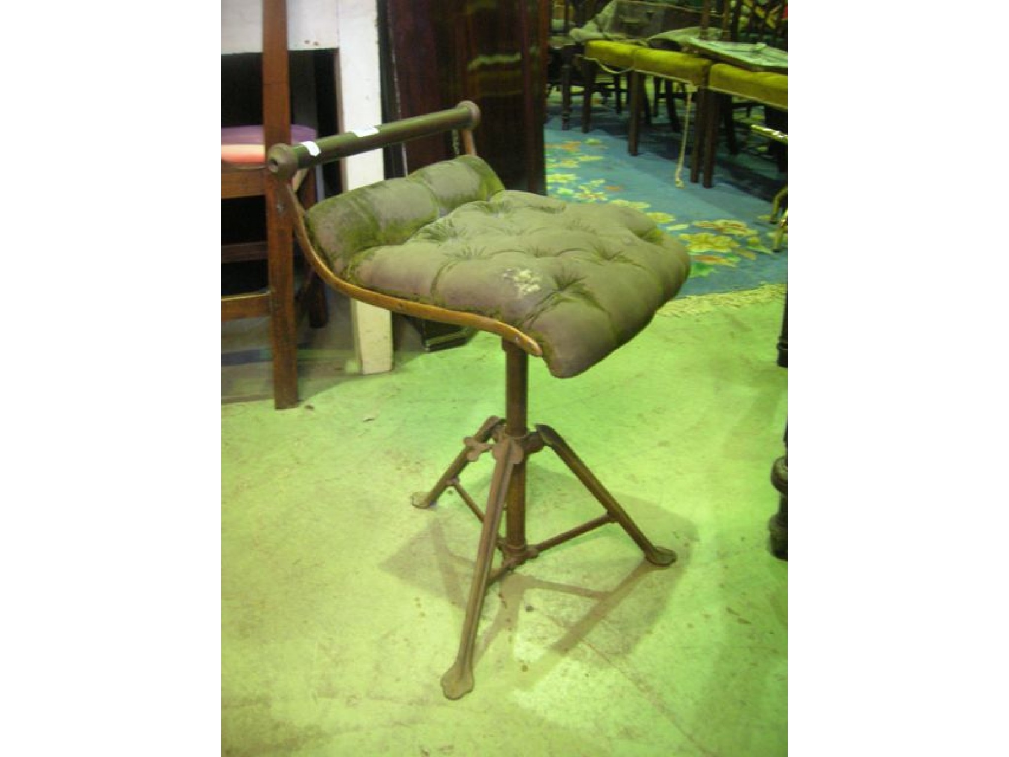 Appraisal: A Victorian brass and cast iron framed music stool the