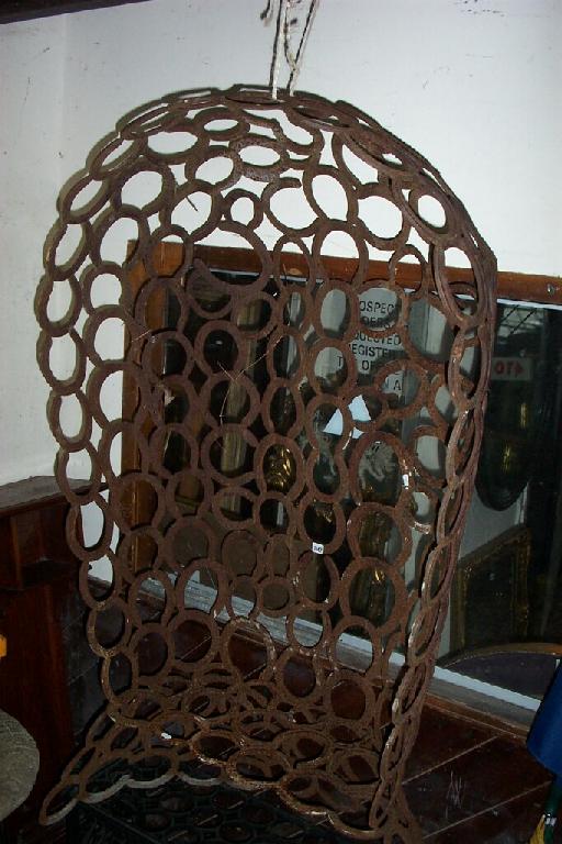 Appraisal: A garden chair with raised back and canopy entirely constructed