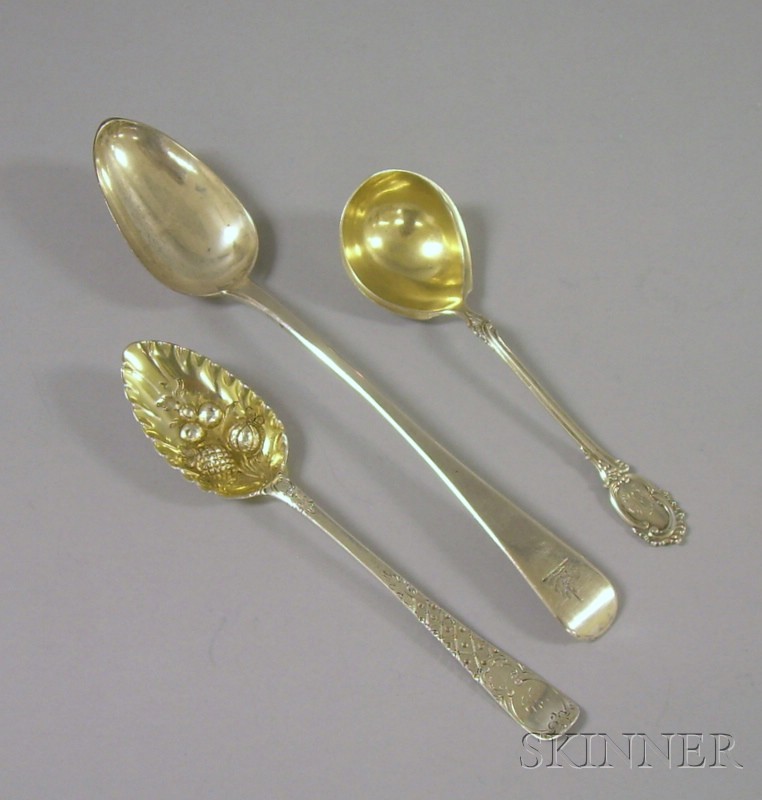 Appraisal: Three Silver Flatware Items Georgian spoon Victorian berry spoon and