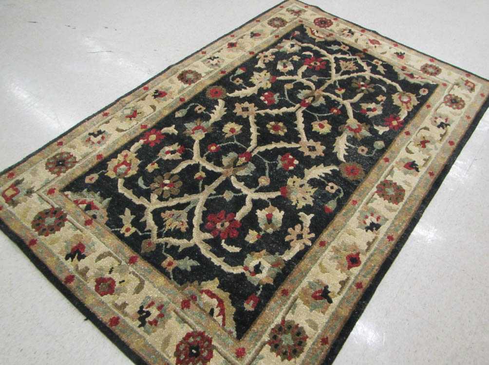 Appraisal: A CONTEMPORARY HAND KNOTTED ORIENTAL CARPET Indo-Persian featuring stylized floral