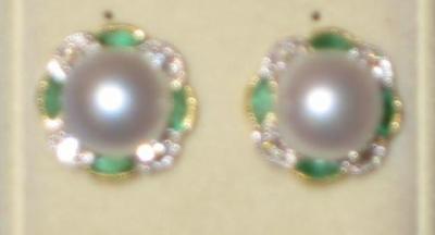 Appraisal: A PAIR OF CULTURED PEARL EMERALD AND DIAMOND EAR STUDS