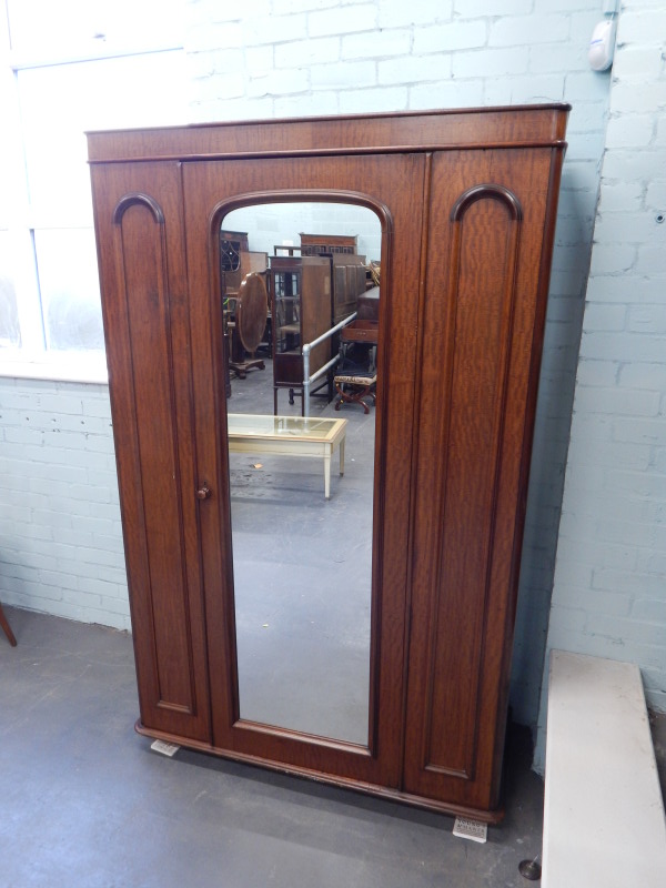 Appraisal: A Victorian mahogany wardrobe with a single mirrored door on