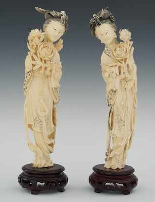 Appraisal: A Matched Pair of Female Attendants Carved Ivory Two maidens