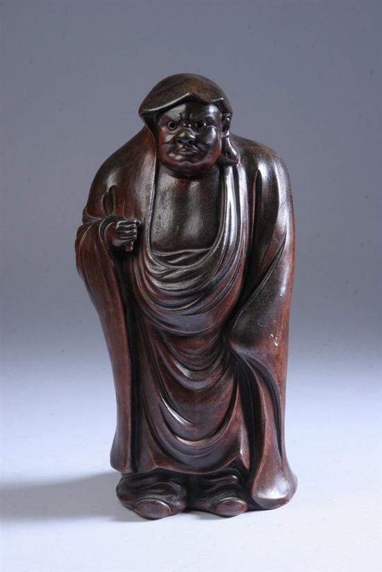 Appraisal: JAPANESE BROWN GLAZED STONEWARE FIGURE OF MAN Marked Made in