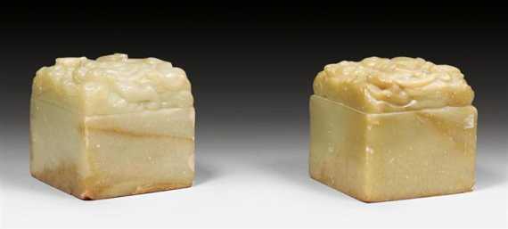 Appraisal: A PAIR OF QINGTIAN STONE SEALS WITH CARVED DRAGONS ON