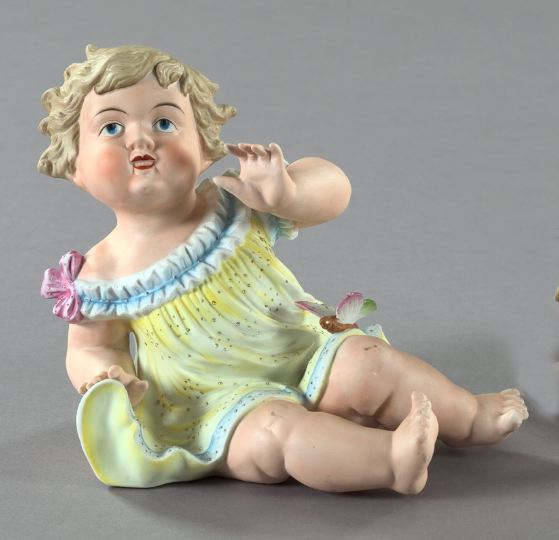 Appraisal: Polychromed Biscuit Porcelain Piano Baby Figure mid- th century depicting