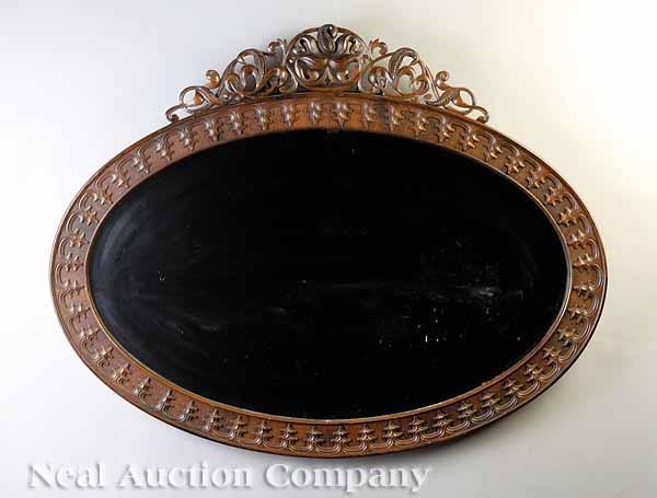 Appraisal: An American Rococo Carved Rosewood Mirror late th c pierced