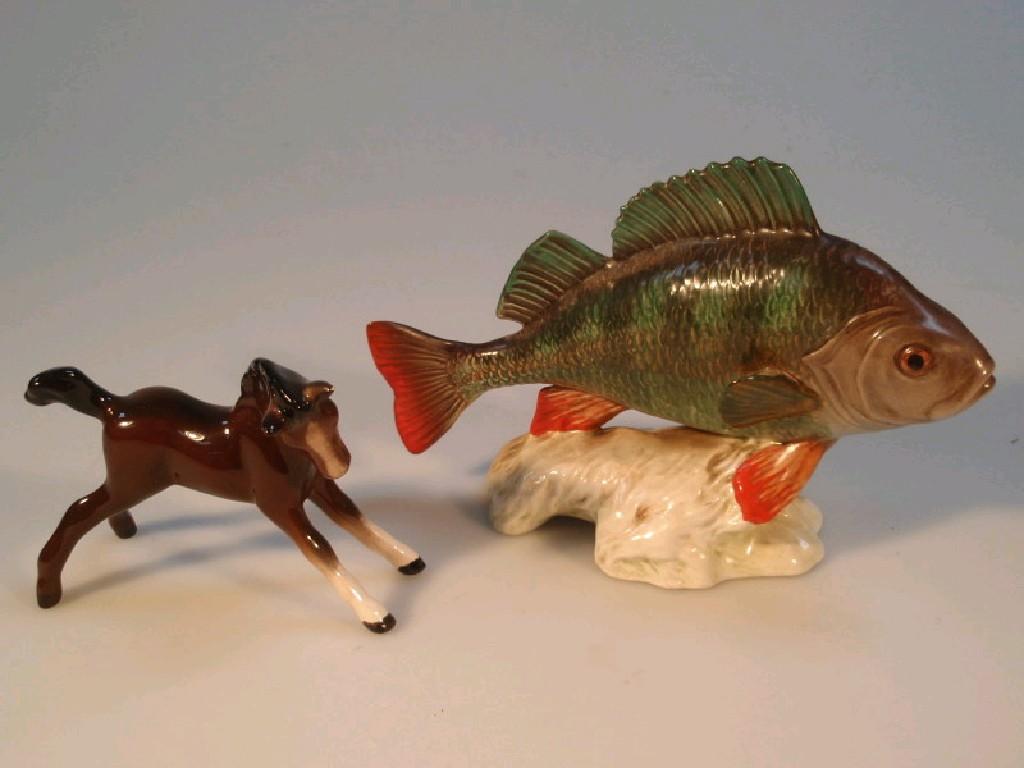 Appraisal: A Beswick perch shape no cm high together with a