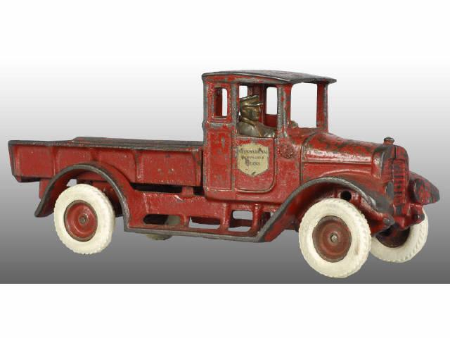 Appraisal: Cast Iron Arcade Red Baby Fixed Bed Truck Toy Description