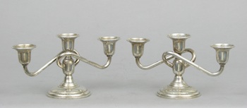 Appraisal: A Pair of Silver Three-Candle Holders A pair of sterling