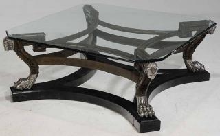 Appraisal: Glass Topped Cocktail Table silver painted tiger mask supports bamboo