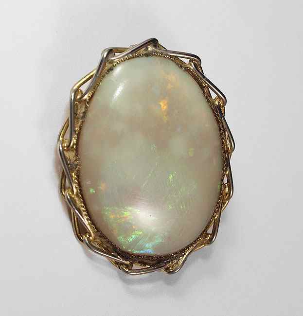 Appraisal: CT OPAL CABOCHON One oval cabochon cut white opal approx