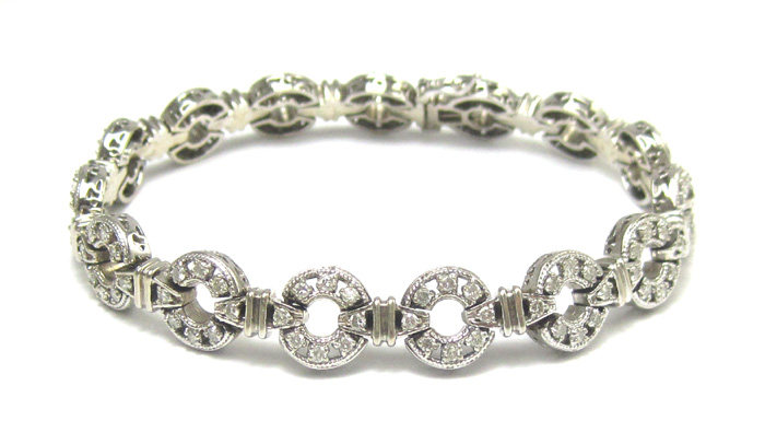 Appraisal: DIAMOND AND FOURTEEN KARAT WHITE GOLD BRACELET measuring - inches