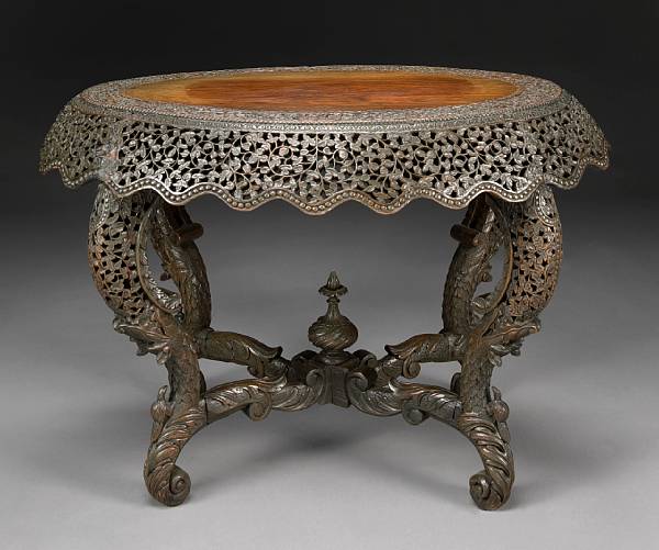 Appraisal: A Burmese ornately carved hardwood center table late th century