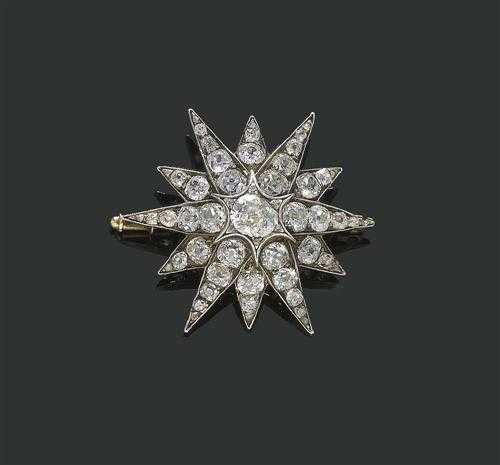 Appraisal: DIAMOND BROOCH ca Silver over ros gold Decorative fine star-shaped