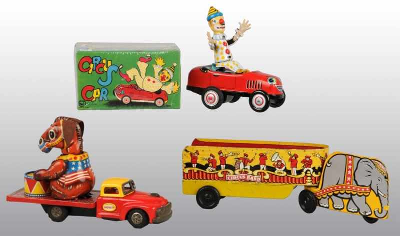 Appraisal: Lot of Tin Litho Circus Vehicle Toys Description Working Includes