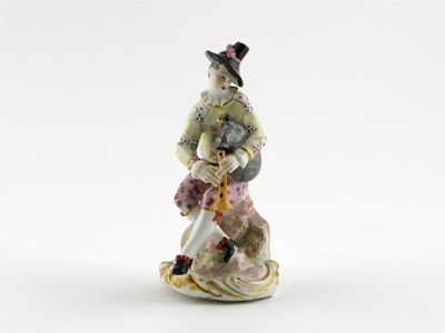 Appraisal: A Thuringian model of Harlequin playing the bagpipes and seated