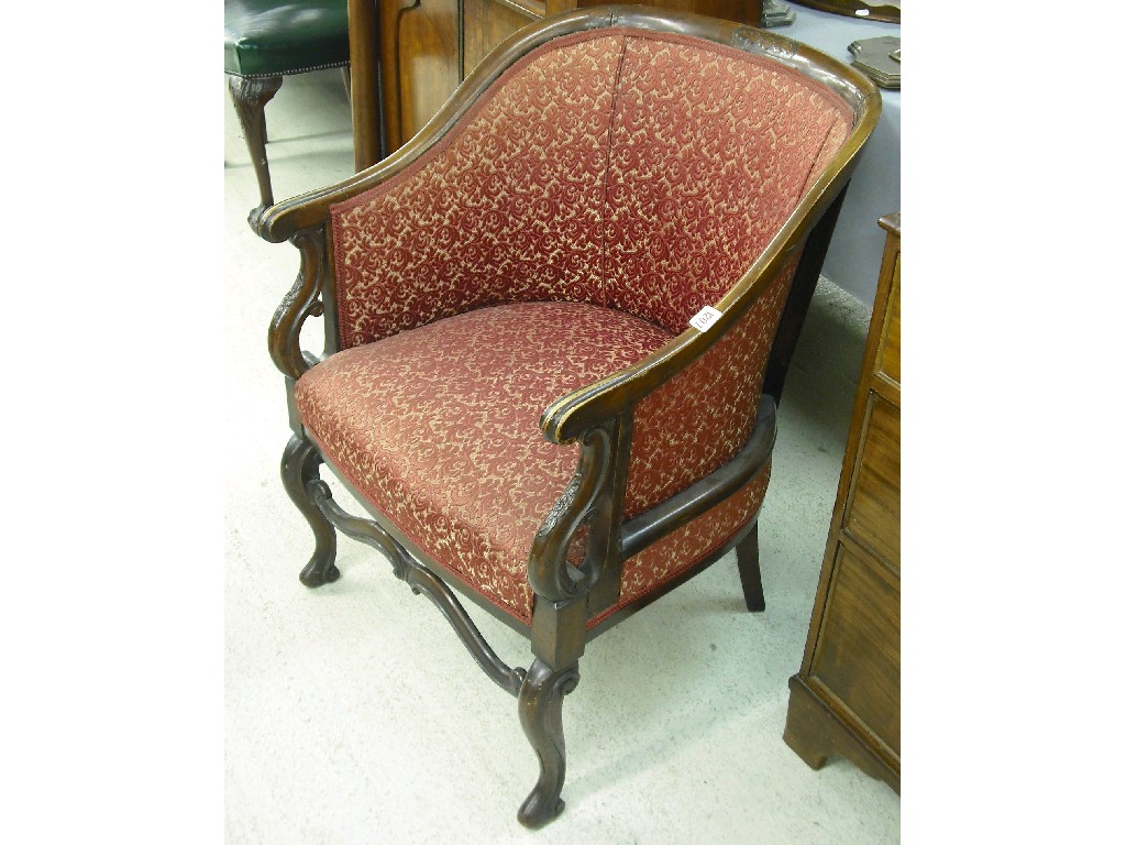 Appraisal: th century mahogany upholstered tub library armchair with carved foliate