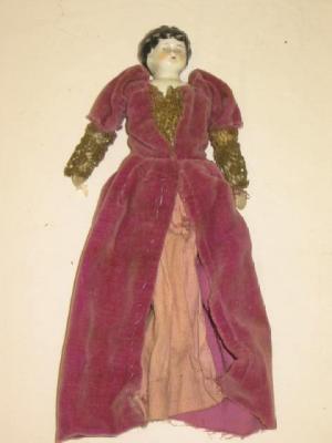 Appraisal: A Victorian china shoulder head doll with moulded and painted