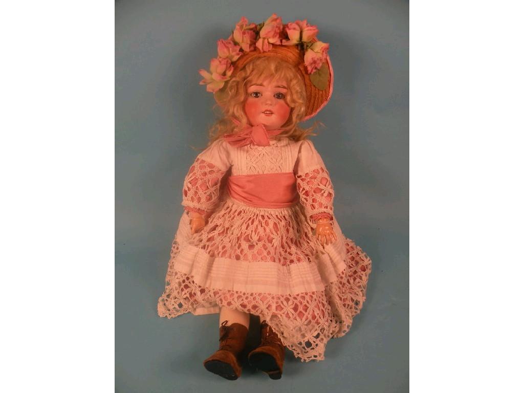 Appraisal: A Felix Arena Mignon bisque headed doll with bi-plane mark