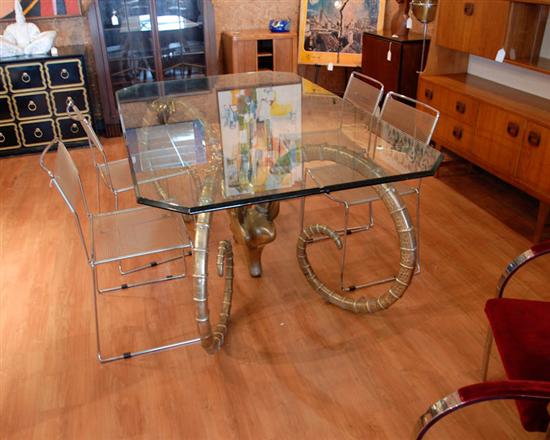 Appraisal: Glass-top Dining Table with Brass Rams' Heads Base heavy beveled