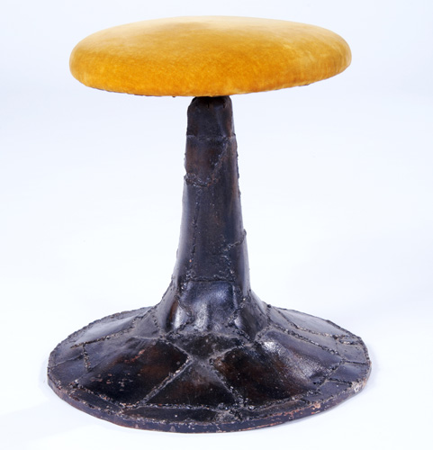 Appraisal: PAUL EVANS Sculpted steel stool with gold velvet upholstery and