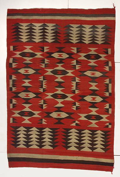 Appraisal: A Navajo transitional rug The central field with serrated diamond