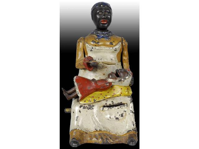 Appraisal: Cast Iron Mammy with Spoon Mechanical Bank Description Manufactured by