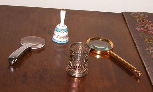 Appraisal: Title Magnifying glasses one silver illuminated Brookstone one gold finish