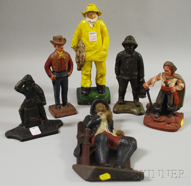 Appraisal: Six Painted Cast Iron Figural Doorstops three fishermen a cowboy