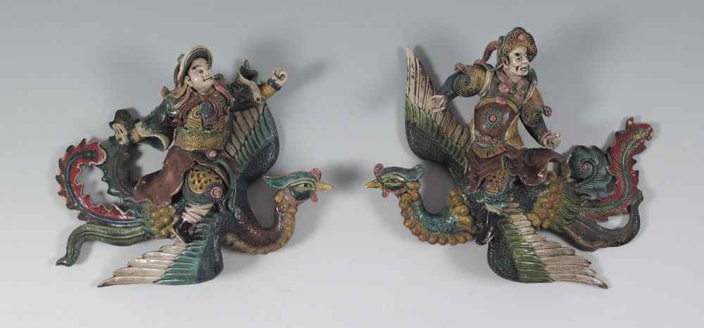 Appraisal: PAIR CHINESE POLYCHROME FIGURAL ROOF TILES Flying mythical birds with