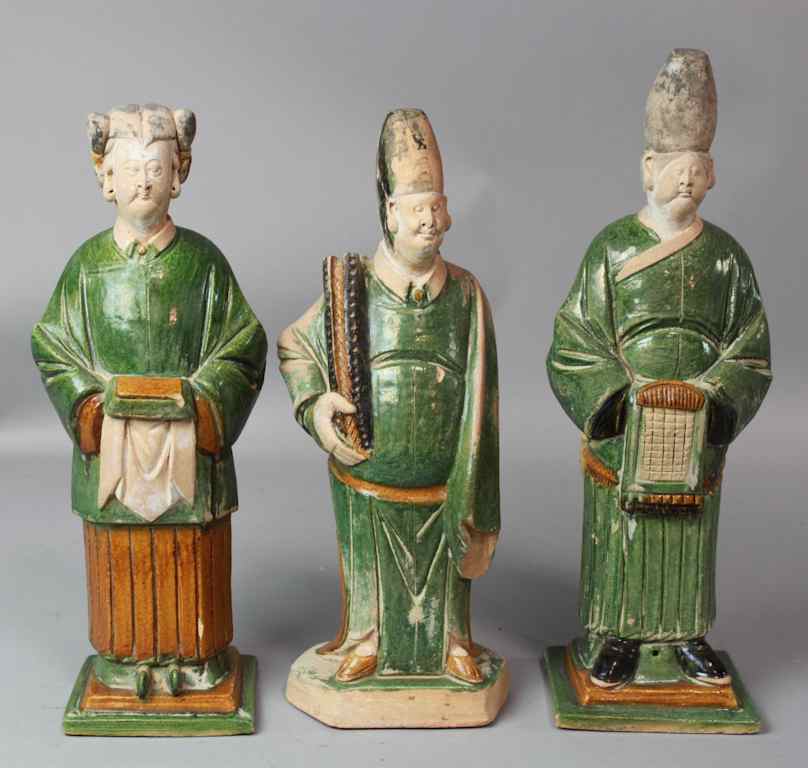 Appraisal: CHINESE SANCAI-GLAZED POTTERY FIGURES MING DYNASTY molded as two gentleman