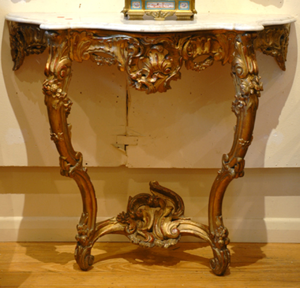 Appraisal: A FRENCH GILT WOOD CONSOLE TABLE The shaped Carrara marble