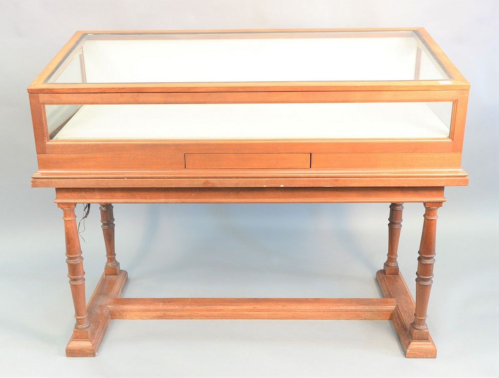 Appraisal: Mahogany showcase having lift-top on tressel base ht wd dp