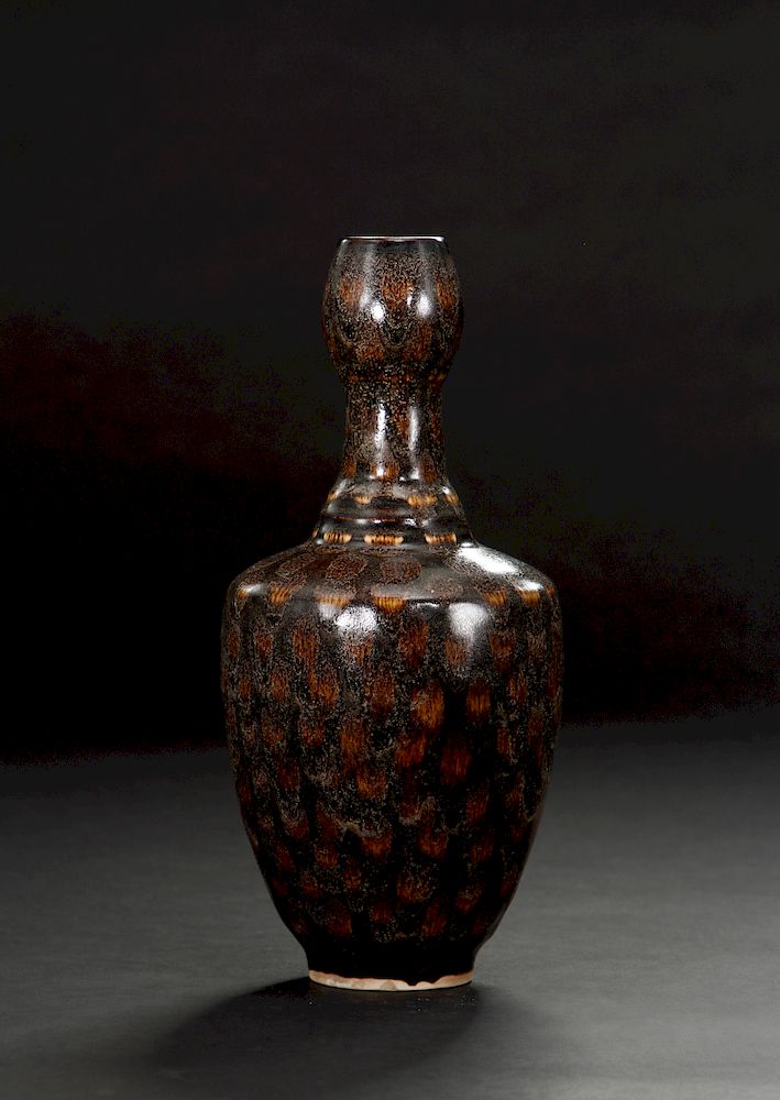 Appraisal: Russet-Splashed Black Glazed Garlic-Mouth Vase The slightly round sides rising