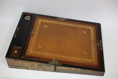 Appraisal: A coromandel lap desk with leather lined writing slope pen