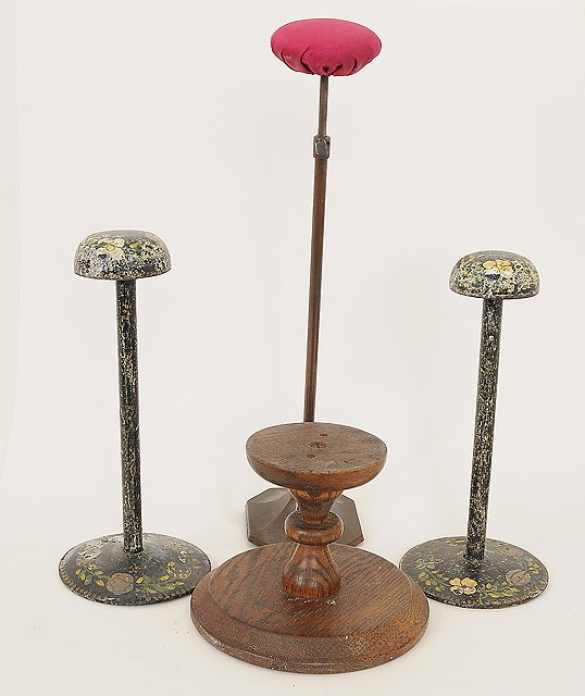 Appraisal: Two tall wooden hat stands one short wooden hat stand