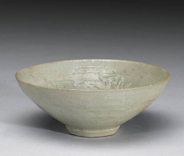 Appraisal: A celadon glazed stoneware deep bowl with molded decoration Goryeo